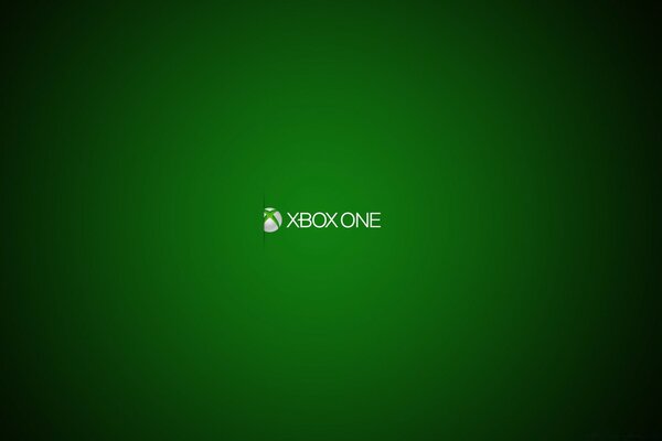 Логотип приставки Xbox One в спотлайті на зеленому тлі